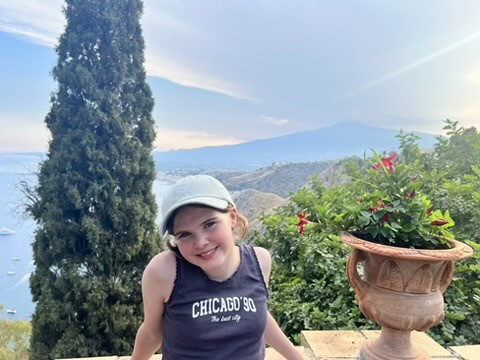 Chloe standing on a balcony in Italy