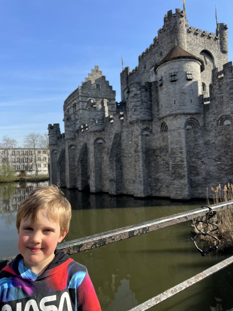 Benjamin standing in front of Ghent castle, Belgium.