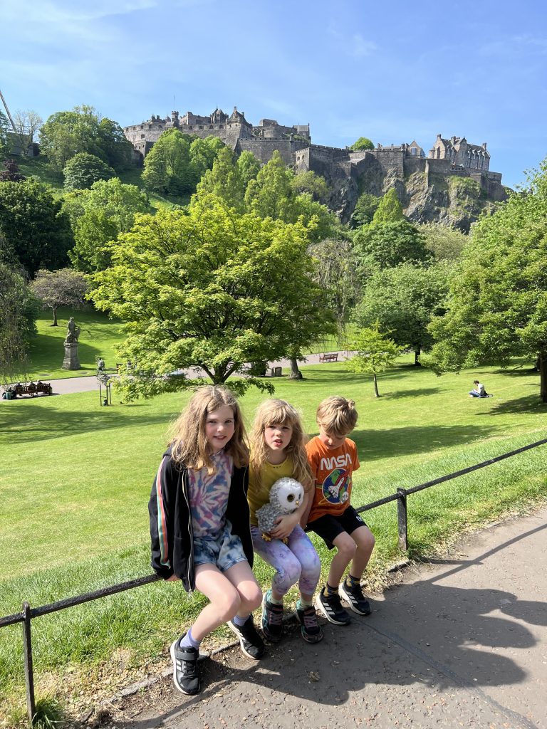 Children in the gardens by Princess street overlooking Edinburgh castle.