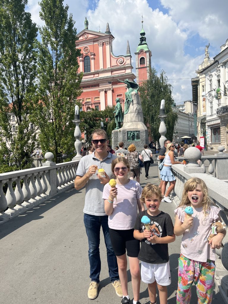 The family standing on a bridge in Ljubljana, Slovenia.