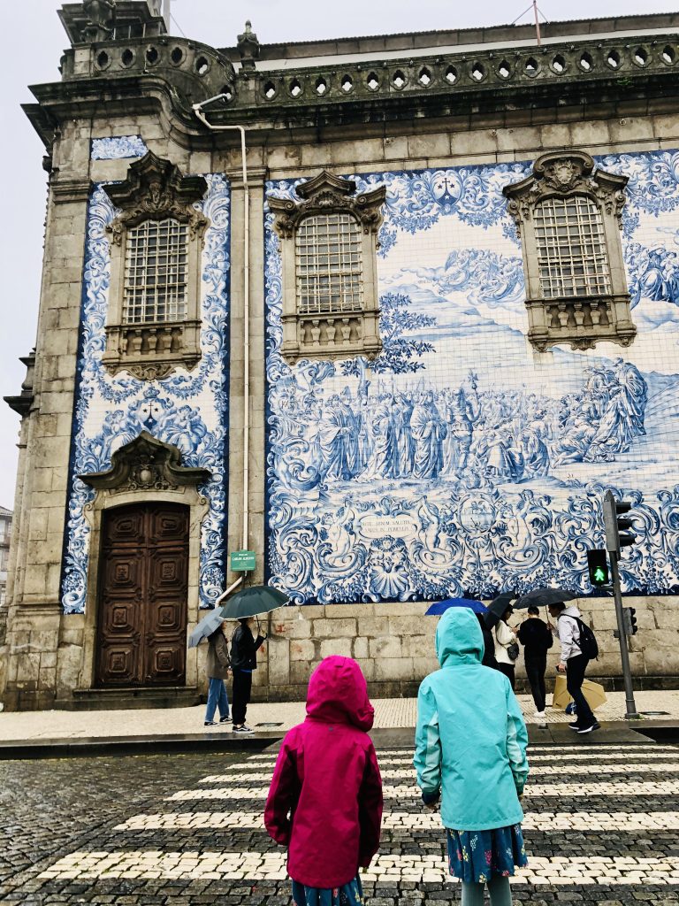 Crossing the road by Igreja de Carmo in Porto