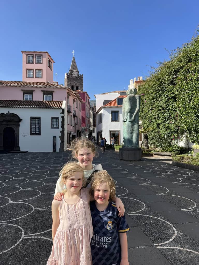 Three children in the Zona Velha, old town of Madeira.