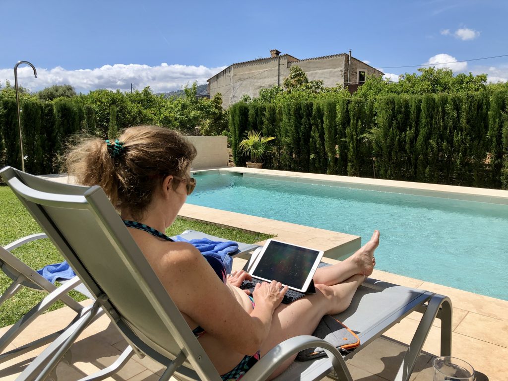 Sitting by the pool in the garden of a villa in Pollença, Mallorca