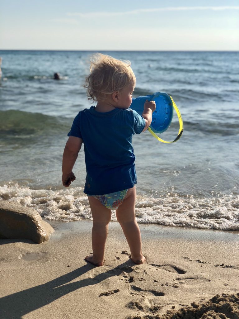 Child on beach at Baia Verde, Puglia