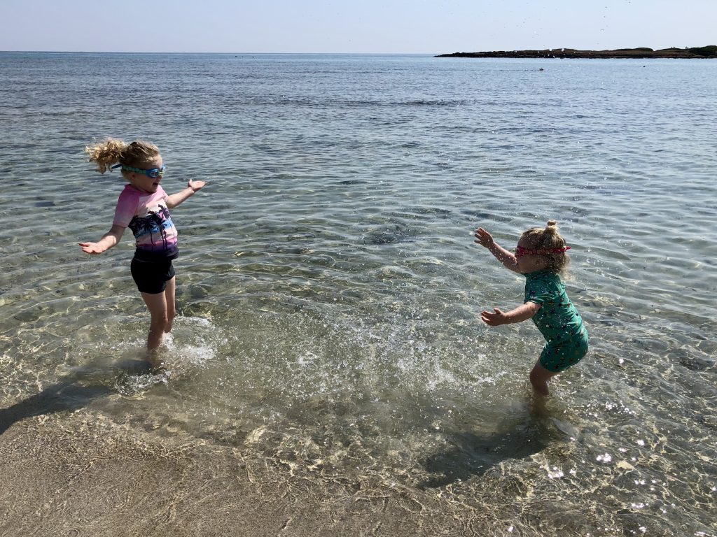 Children playing on Monte beach, Puglia