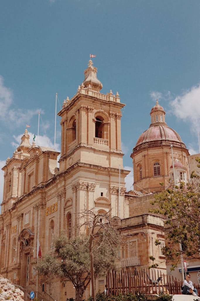 Baroque architecture of St. Paul's Cathedral in Valletta, Malta under a clear sky.