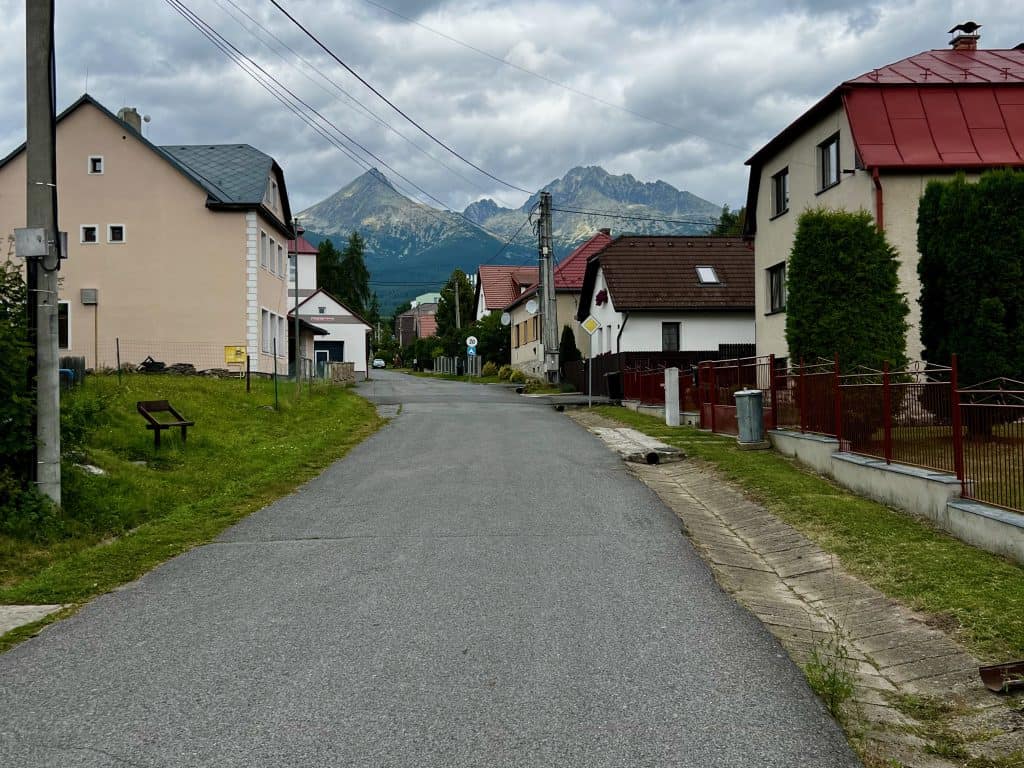 The road through the small village of Stola in the High Tatras national park, with mountains seen in the background.