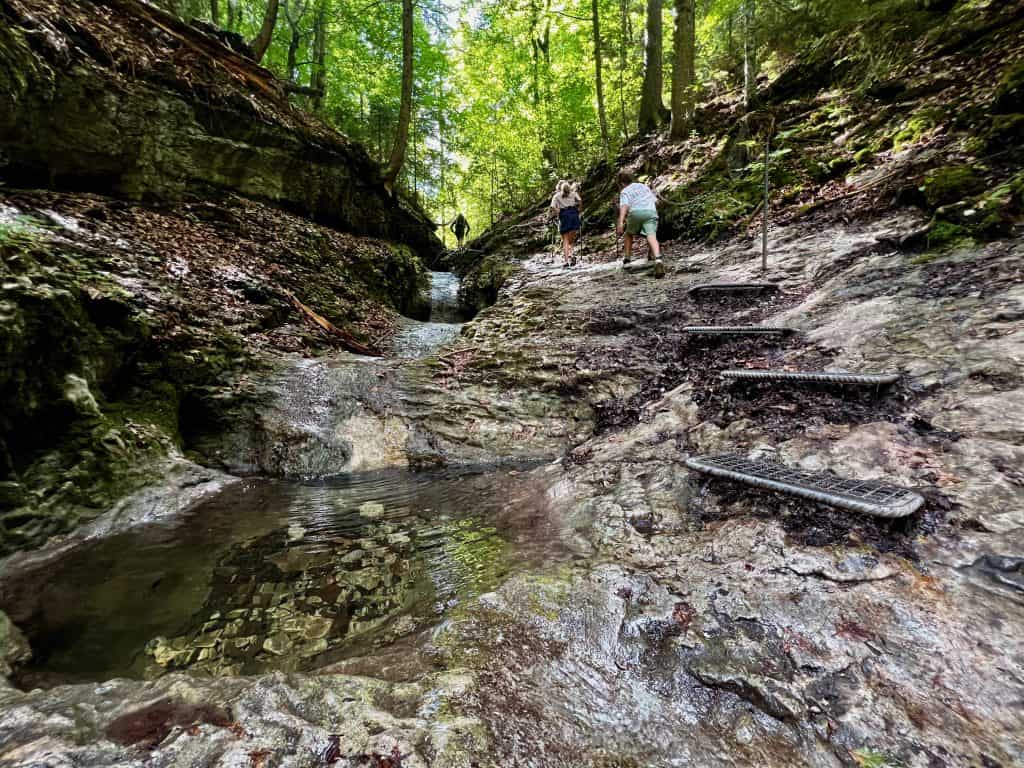 Children hiking the Sucha Bela gorge in Slovak Paradise National Park in Slovakia.