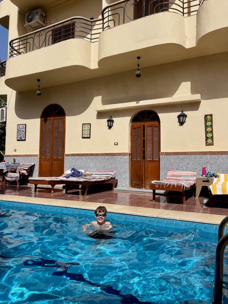 Benjamin in the pool at the best budget hotel in Luxor, Villa Belzoni.