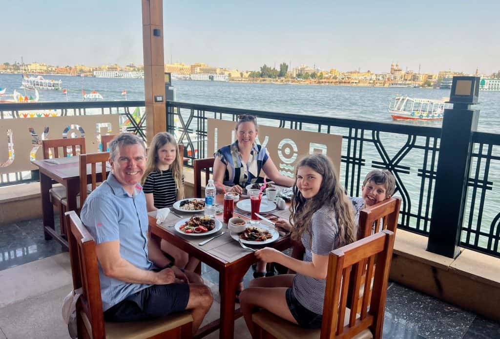 Family meal at a restaurant in West Bank of Luxor overlooking the Nile.