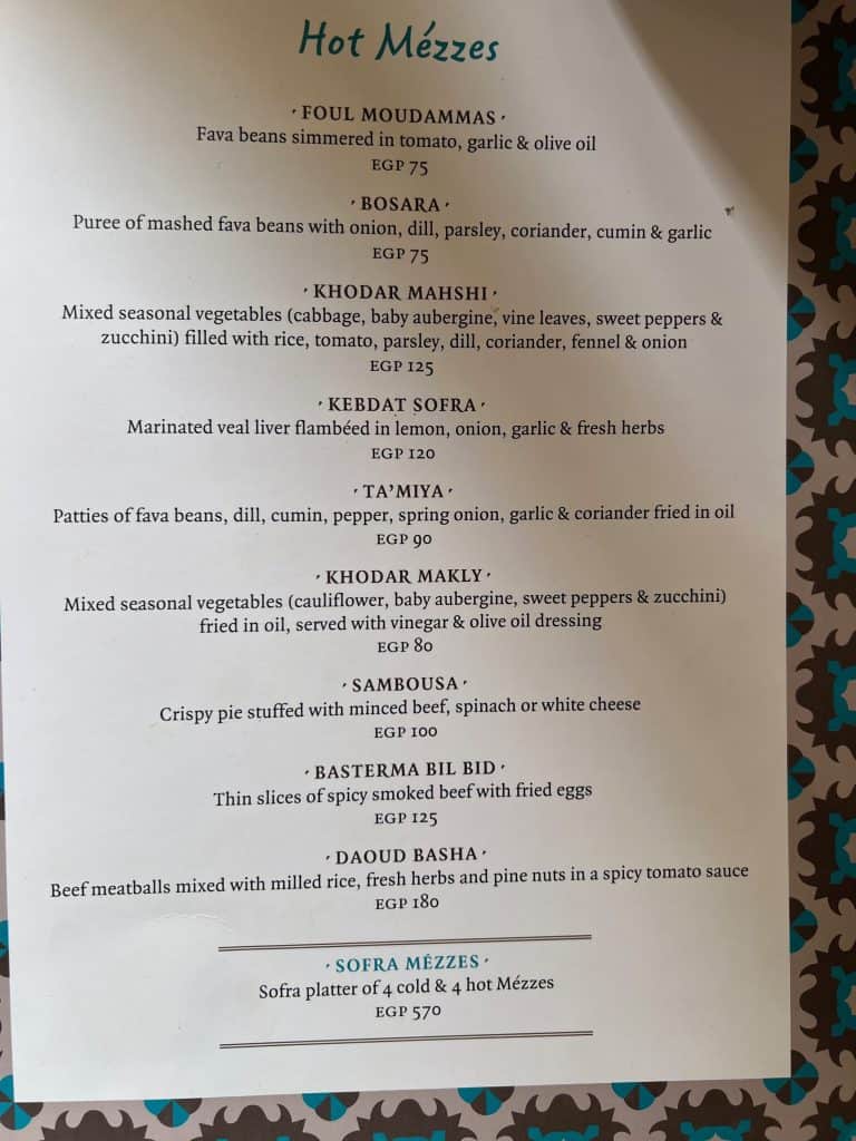 A photograph of the menu showing the hot Mezze available at Sofra Restaurant in Luxor.