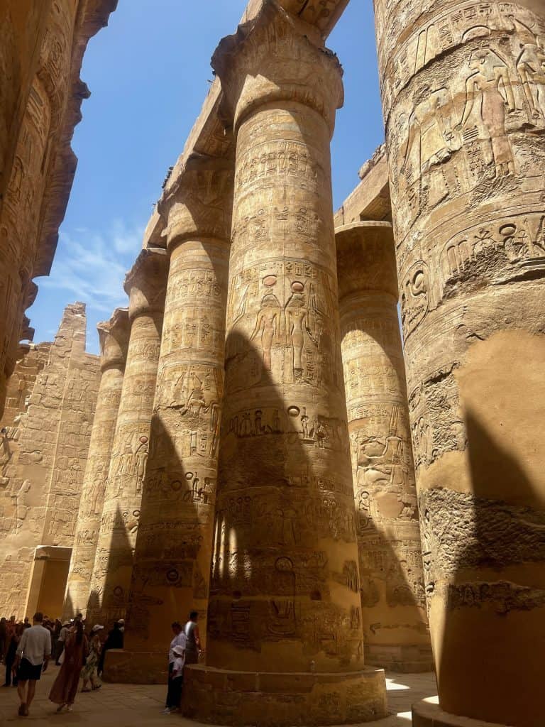 Columns of the great Hypostyle Hall at Karnak Temple, Luxor. Hieroglyphics can been adorning many of the columns.