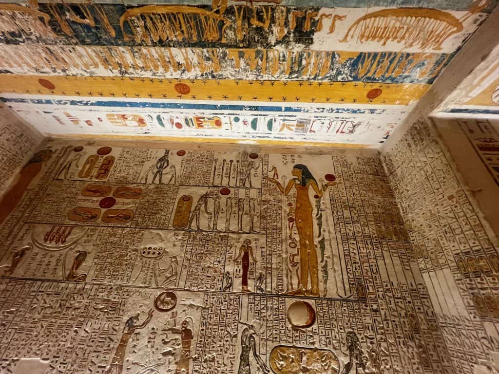 Ancient egyptain pictures and hieroglyphics on the walls of a tomb in Valley of the Kings, Luxor.