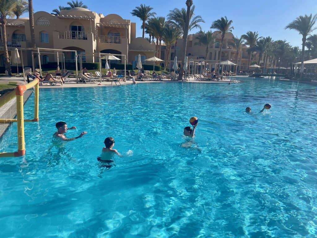 View of Jaz Makadina swimming pool with the hotel bedrrom area visible in the background.